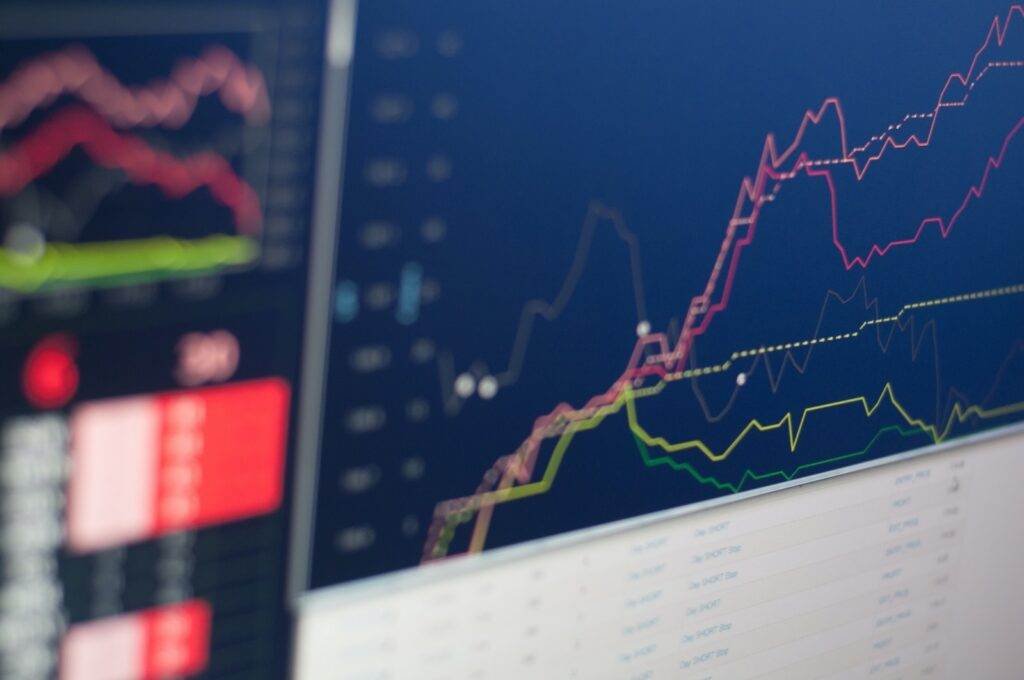 close-up photo of monitor displaying graph, long-term dividend snowball