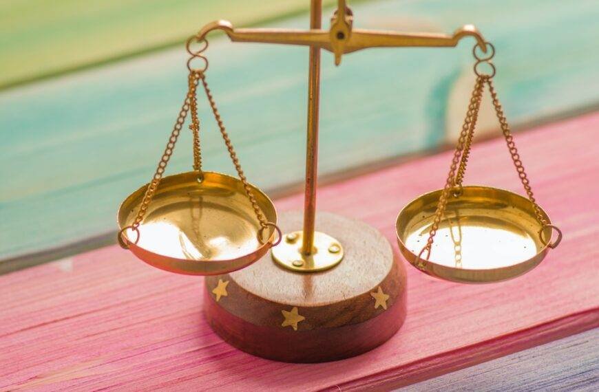 gold and silver round frame magnifying glass and thinking about the margin of safety ratio