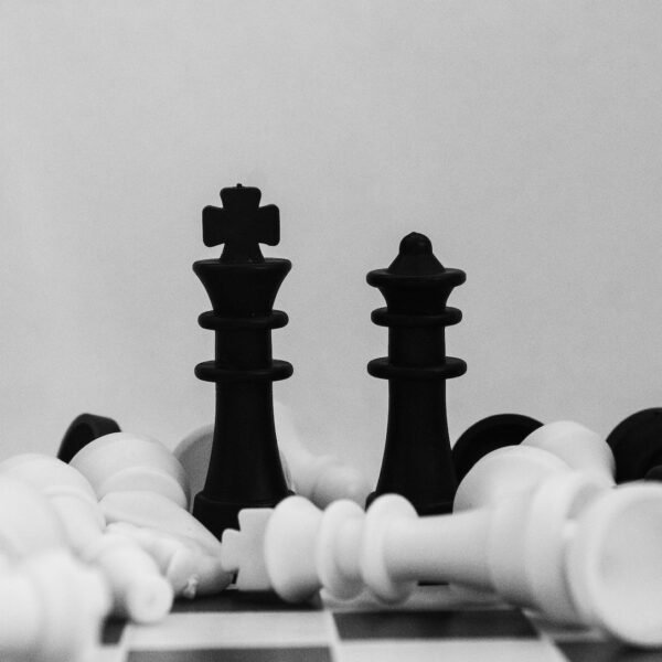black and white chess piece; dollar cost averaging, investing, dividend stocks
