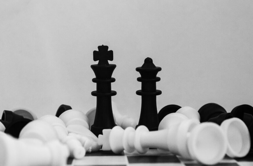 black and white chess piece; dollar cost averaging, investing, dividend stocks